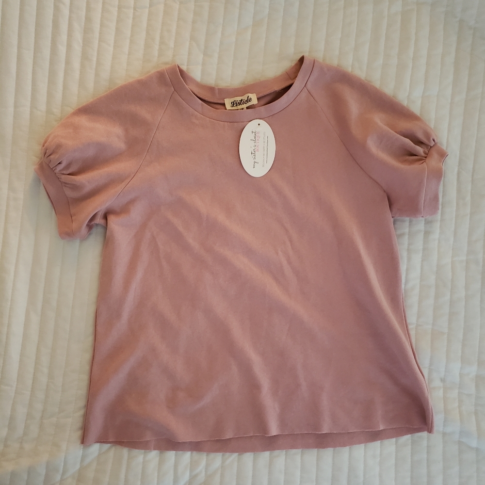 Blush pink top with bubble sleeved. New with tags